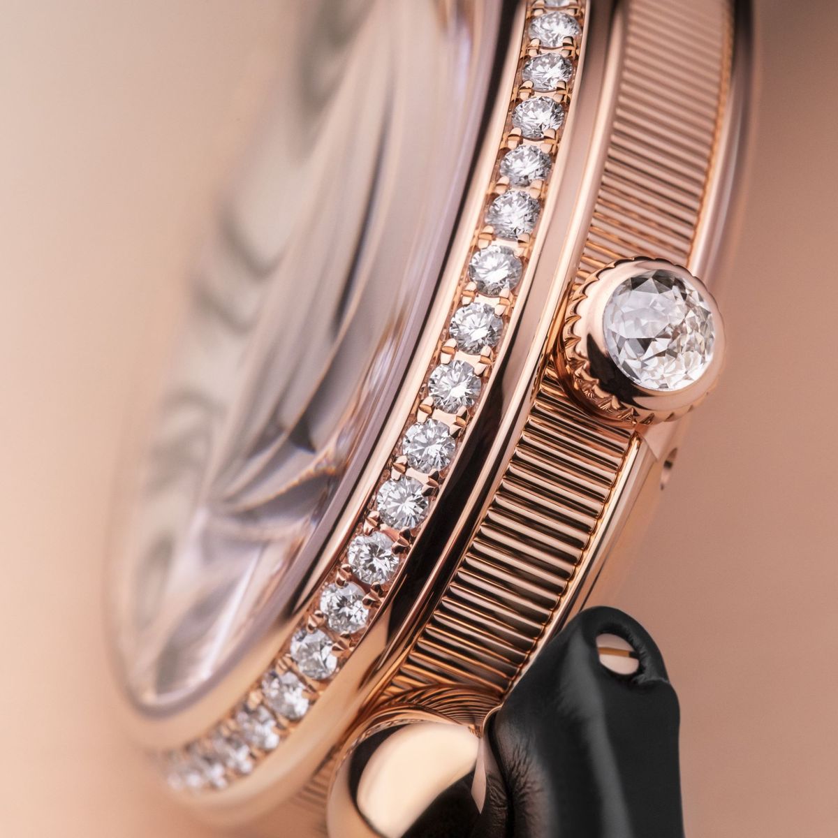 Diamond-set watch bezel close-up showing precision stone setting